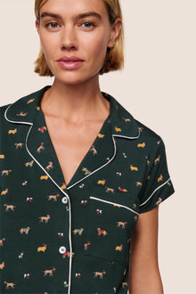 Model is wearing Gisele Printed TENCEL Modal Shortie Short PJ Set  in Holiday Dogs Pine/Ivory