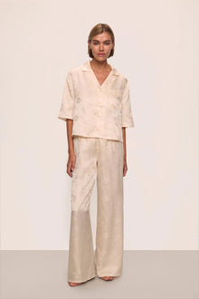 Model is wearing Inez Washable Silk Jacquard Relaxed Wide Leg Pant PJ Set in  Floral Vine Peach Dust
