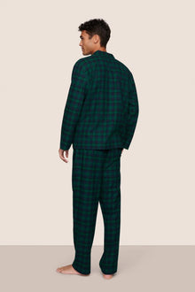 Model is wearing Men's Flannel Long PJ Set  in Blk Watch Tartan Rainforest/Na
