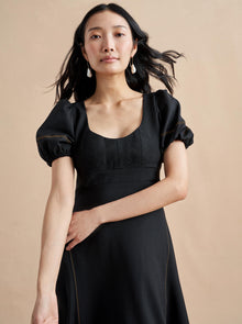Named after La Bande member and entrepreneur, Jennifer Rubio, this impossibly chic, wool-blend, fitted (don't worry, we smocked it at the back) bodice with trapunto stitching and a full skirt for full attitude.