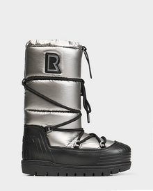 The Rudsak TISH - L223508 Pewter is a womens high-top winter boot with a shiny silver upper, black platform sole, crisscross laces, quilted design, bold R patch near the top, and a chunky ridged sole for extra traction.