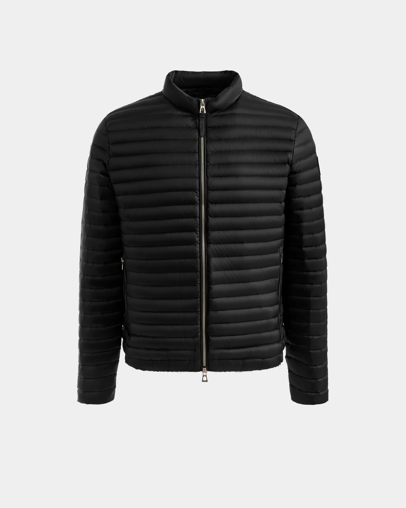 The Rudsak REYMOND M - M125523 Black men’s down jacket features RDS-certified down, quilted horizontal stitching, a zip-up front, long sleeves, and a short collar, shown against a plain light gray background.