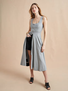 Inspired by La Bande member Selby Drummond, this grey, sleeveless dress with smocked back for ease and a two way zipper to show as little or as much décolleté (or leg) is where comfort meets chic. Elevated with a hint of sport, feel free to run away with this dress in a flat boot or simply strut into a room when you wear it with heels. Just like Selby, there is nothing this dress can't do.
