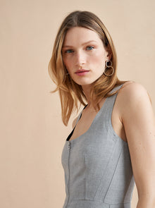 Inspired by La Bande member Selby Drummond, this grey, sleeveless dress with smocked back for ease and a two way zipper to show as little or as much décolleté (or leg) is where comfort meets chic. Elevated with a hint of sport, feel free to run away with this dress in a flat boot or simply strut into a room when you wear it with heels. Just like Selby, there is nothing this dress can't do.