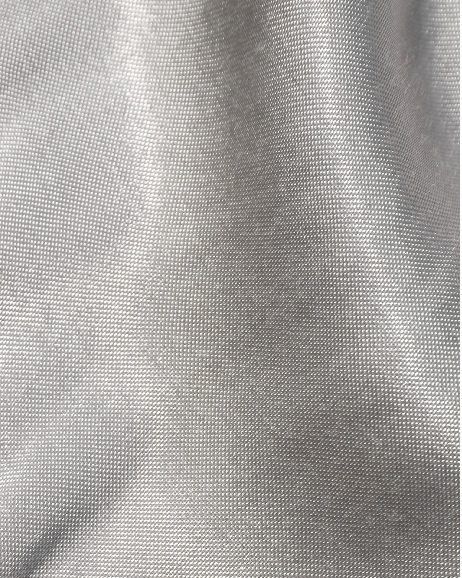 Close-up of the LSPACE Sweet As Honey Skirt in silver, showing the luminous woven satin fabric texture with a metallic silver sheen.