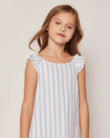 Blue and white striped dress with ruffled shoulders on a white background