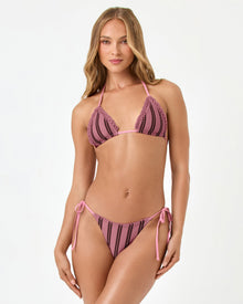 front view of woman wearing a pink and brown striped bikini on a white background