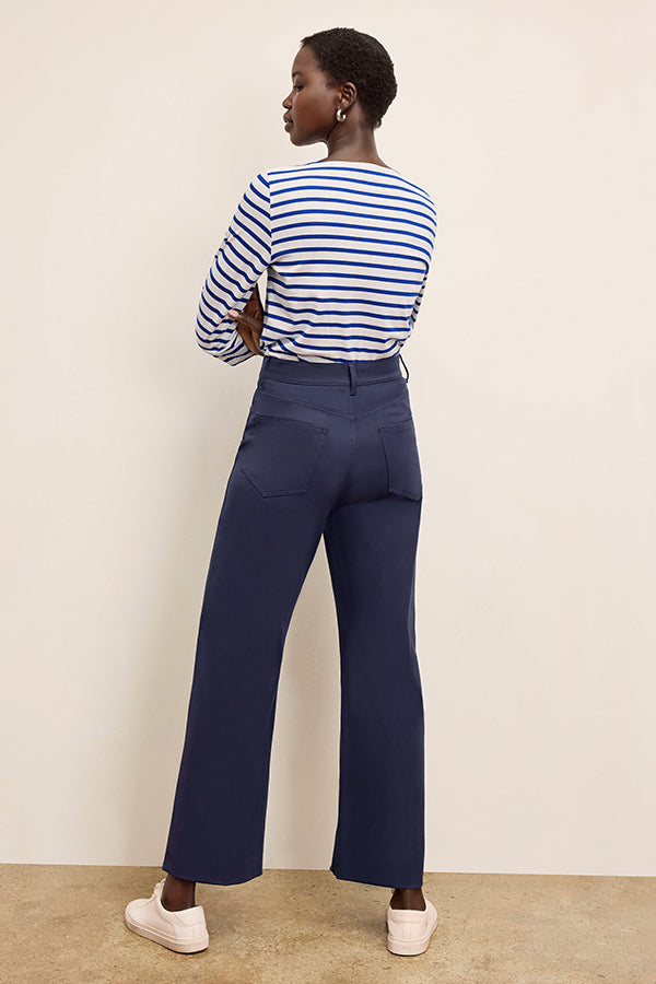 Back image of a woman standing wearing the Milo Jean in ink | Exclude | Grid Hover