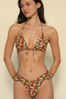 Floral bikini bottom in red, yellow, and white print with high-leg cut and side tie details.