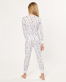 Kid's Pima Snug Fit Pajama Set in Merry Meow features a long-sleeve button-up top and matching pants with winter and holiday-themed prints of cats, trees, presents, and snowmen on a white background.