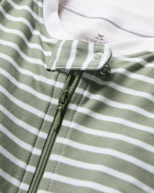 The Baby's Pima Romper in Sage Stripe is a green and white striped sleeper with long sleeves, white cuffs, covered feet, and a diagonal front zipper from the collar to one leg.