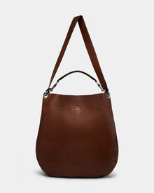 The Rudsak VIKA - 8325036 Mocha is a large women’s brown leather hobo shoulder bag with a wide strap, small top handle, silver-tone hardware, and subtle front logo—an ideal stylish everyday accessory shown on a plain white background.