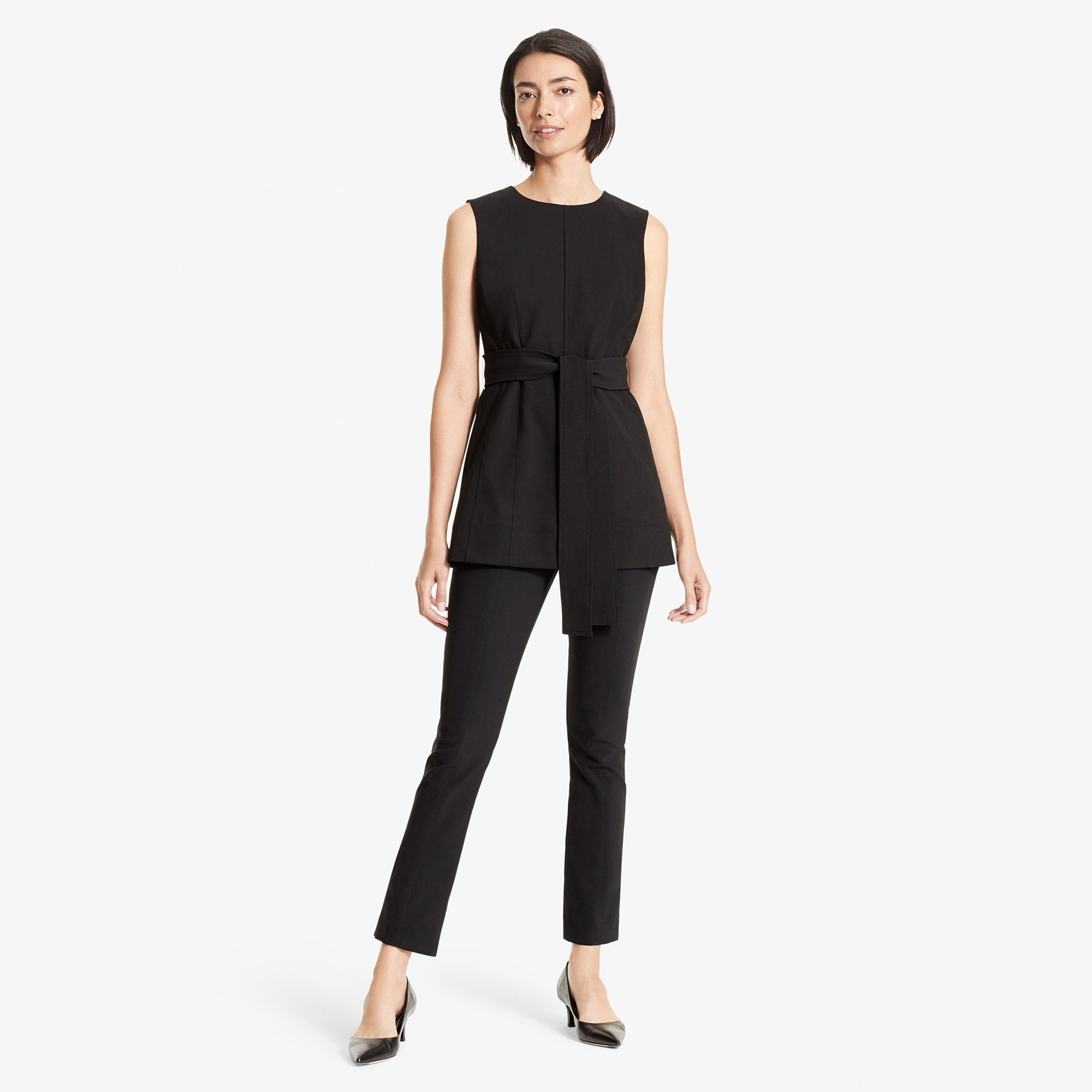 Front image of a woman standing wearing the Angelina top in Black | Exclude