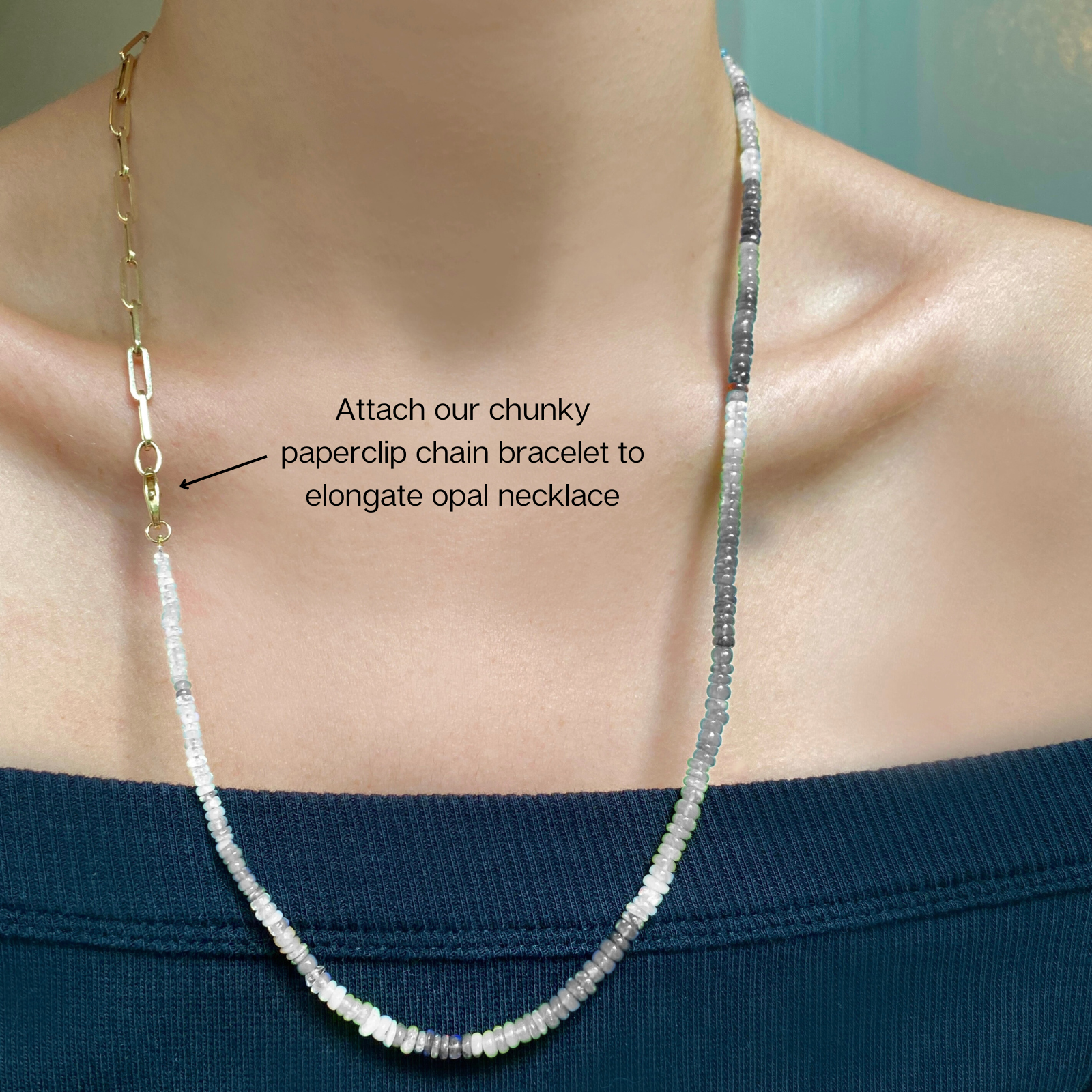 Shimmering beaded necklace made of faceted opals in shades of light blue, light purple, yellow, white, and clear on a gold linking ovals clasp.