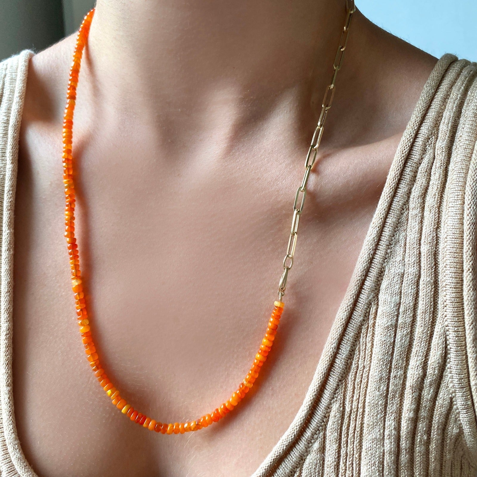 14k gold Chunky Paperclip Chain Bracelet with a lobster clasp on neck attached to a beaded opal necklace