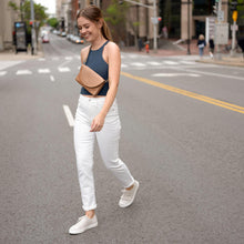 Nisolo Women's Go-To Eco-Knit Sneaker Linen image of woman wearing the shoe while crossing the street