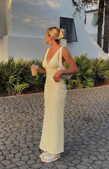 Beginning Boutique Evilia Yellow Midi Dress pale yellow textured V-neck sleeveless midi dress with ruched bust and empire waist